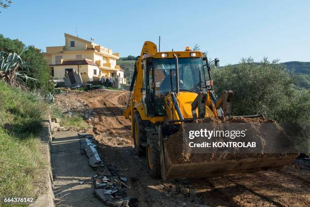 The steps of refurbishment work to reach completely collapsed houses because of the wide landslide unleashed in recent days by the heavy rains of the...