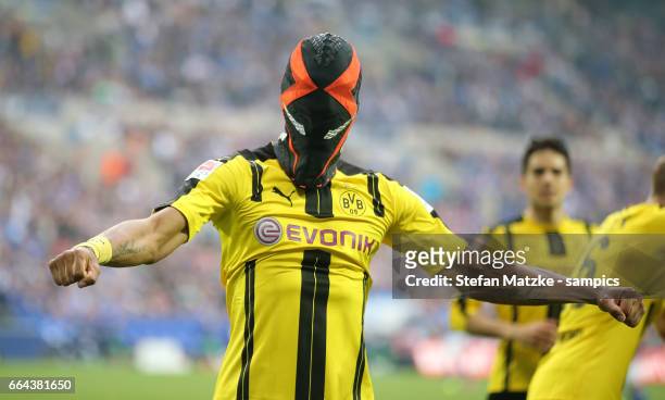 Pierre Emerick Aubameyang celebrates as he scores the goal with a mask during the Bundesliga match between FC Schalke 04 and Borussia Dortmund at...