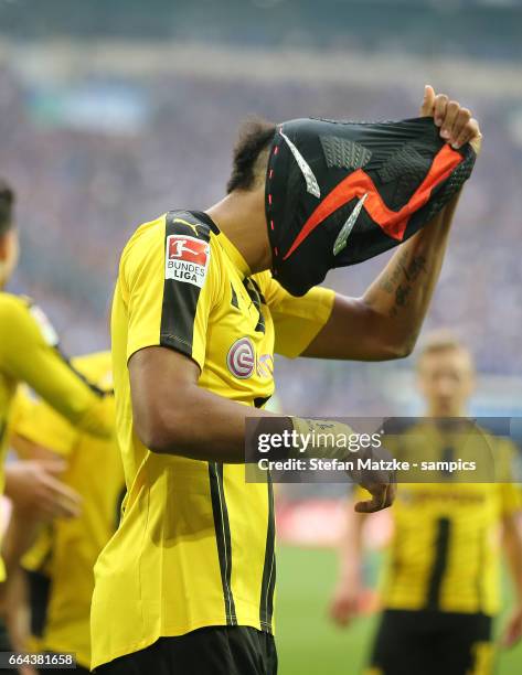 Pierre Emerick Aubameyang celebrates as he scores the goal with a mask during the Bundesliga match between FC Schalke 04 and Borussia Dortmund at...