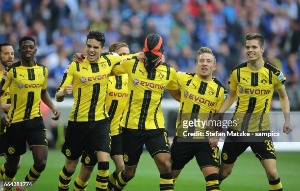 Pierre Emerick Aubameyang celebrates as he scores the goal with a mask with Marc Barta Borussia Dortmund Felix Passlack Borussia Dortmund Julian...