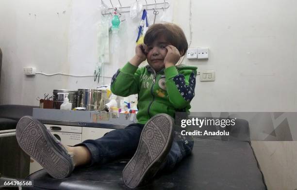 Child gets treatment at a hospital after Assad Regime forces attacked with suspected chlorine gas to Khan Shaykhun town of Idlib, Syria on April 4,...