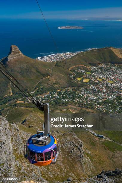 cable car climbing up to the top of table mountain, cape town, south africa - cape town cable car stock pictures, royalty-free photos & images