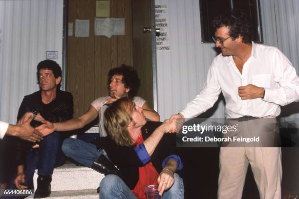 Deborah Feingold/Corbis via Getty Images) CHAMPAIGNLou Reed, Bob Dylan, Tom Petty and Randy Newman posing on September 22, 1985 in Champaign,...