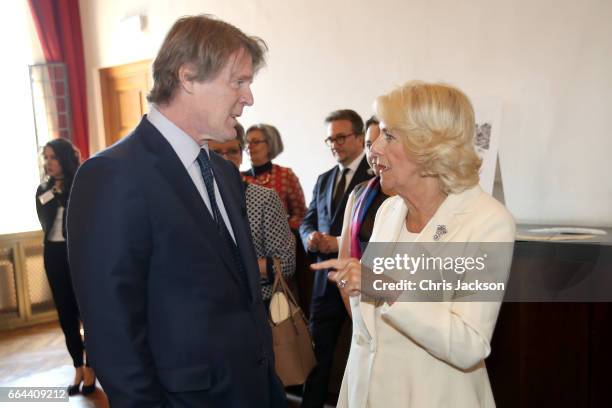 Camilla, Duchess of Cornwall talks to Mark Getty at The British School on April 4, 2017 in Rome, Italy.