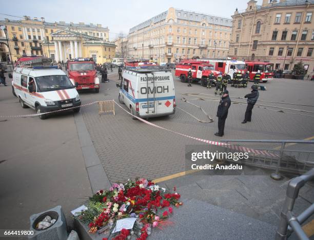 People lay flowers at a Sennaya Ploshchad subway station in St Petersburg, Russia on April 4, 2017.