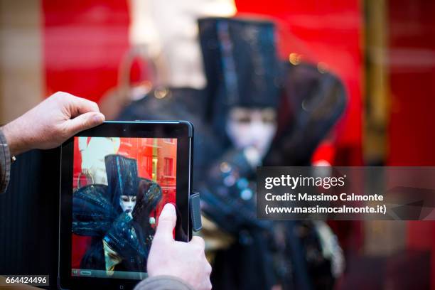 venice mask photographed with a digital tablet - venice carnival 2013 stock pictures, royalty-free photos & images