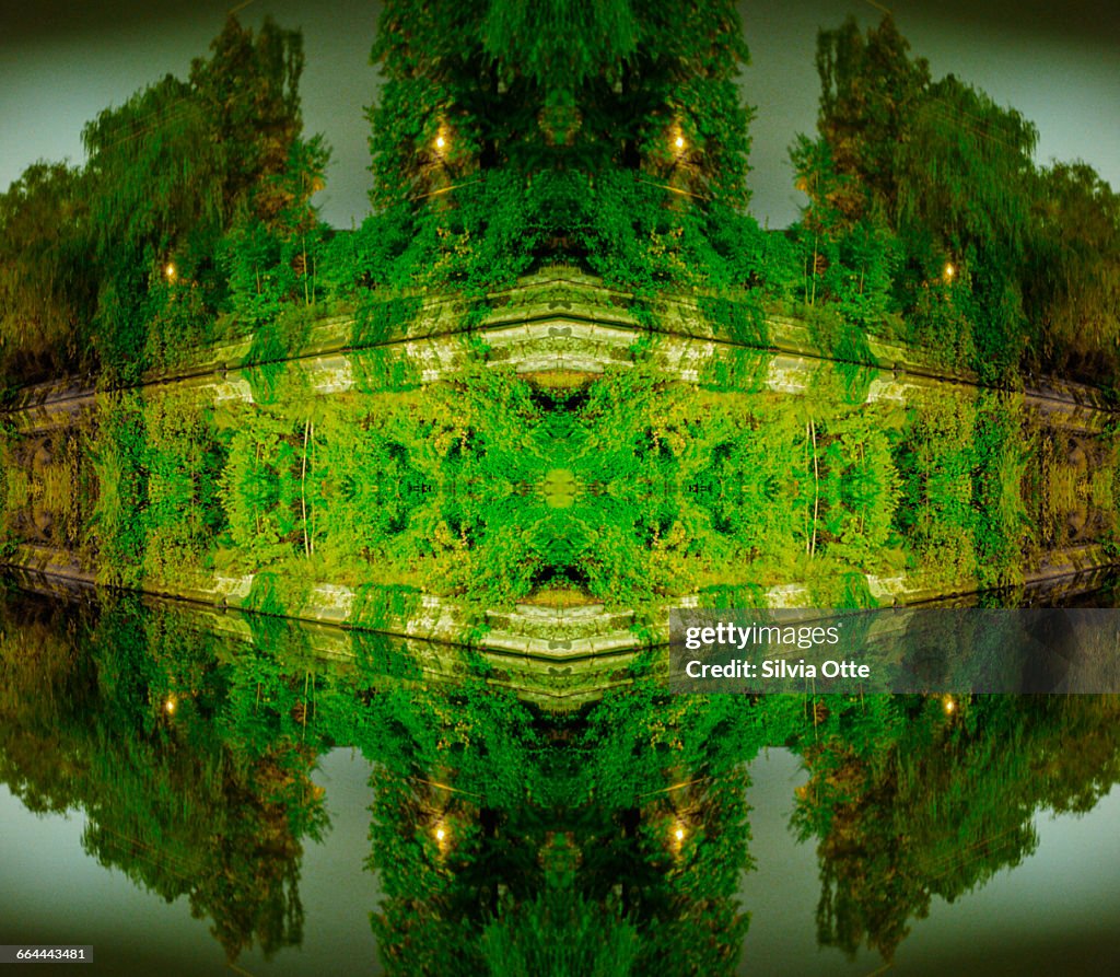 Kaleidoscope photo of green trees by canal