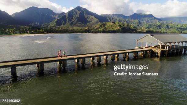 three woman jogging - hanalei stock pictures, royalty-free photos & images