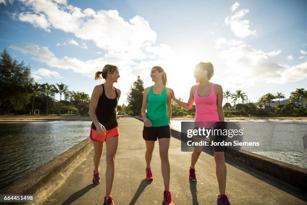 three women exercising - ladies shorts stock pictures, royalty-free photos & images