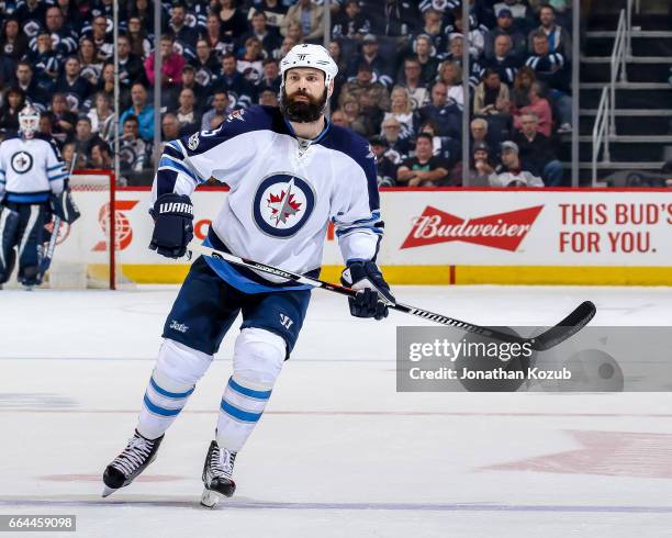 Mark Stuart of the Winnipeg Jets keeps an eye on the play during second period action against the Anaheim Ducks at the MTS Centre on March 30, 2017...