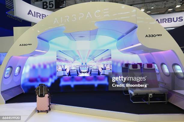 Promotional display demonstrates the 'cabin experience' and interior seating of an Airbus Group A330 neo aircraft in the Airbus Airspace pavilion at...