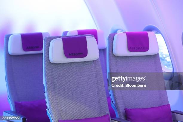 Promotional display demonstrates the 'cabin experience' and interior seating of an Airbus Group A330 neo aircraft in the Airbus Airspace pavilion at...
