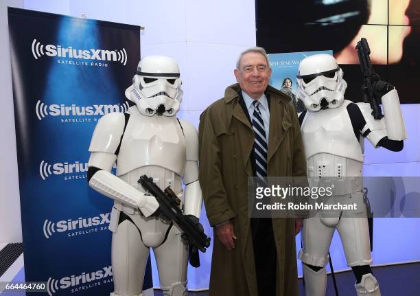 SiriusXM host Dan Rather poses with Stormtroopers for Blu-Ray release of Rouge One at SiriusXM Studios on April 4, 2017 in New York City.
