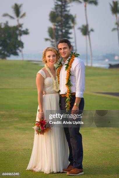 couple pose for photos after hawaii wedding. - interracial wife photos stock-fotos und bilder