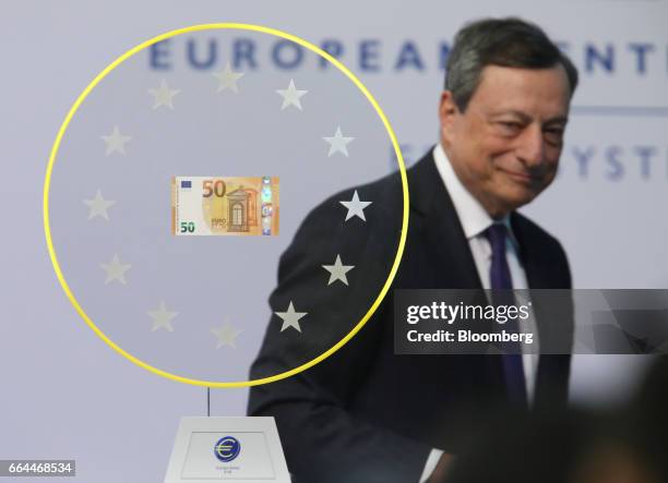 Mario Draghi, president of the European Central Bank , arrives to unveil the new 50 euro currency bank note at the ECB headquarters in Frankfurt,...