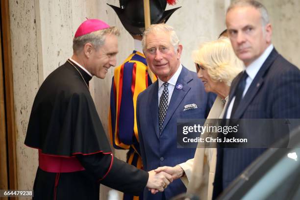 Prefect of the Papal Household Georg Gaenswein greets Prince Charles, Prince of Wales and Camilla, Duchess of Cornwall prior to the meeting with Pope...