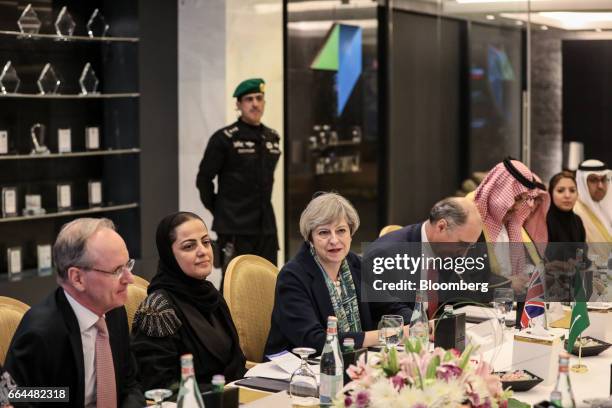 Theresa May, U.K. Prime minister, center, looks on as she attends a meeting with Xavier Rolet, chief executive officer of London Stock Exchange Group...