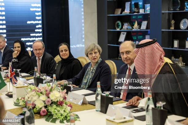 Theresa May, U.K. Prime minister, center, looks on as she attends a meeting with Xavier Rolet, chief executive officer of London Stock Exchange Group...