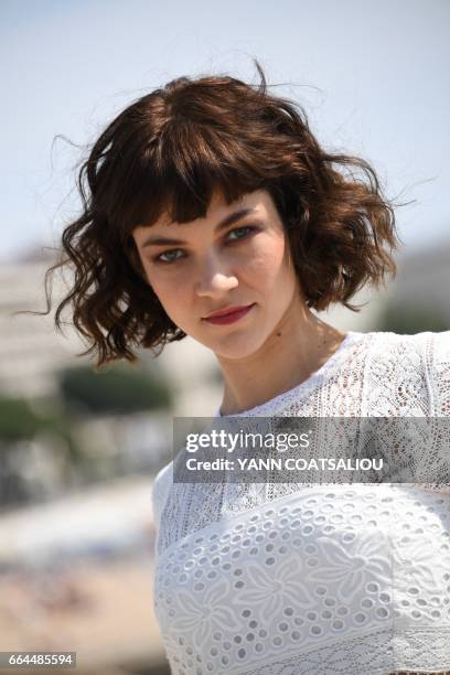 Actress Olivia Ross, performing in "Knightfall" TV drama, poses during the MIPTV event in Cannes, southern France, on April 4, 2017.