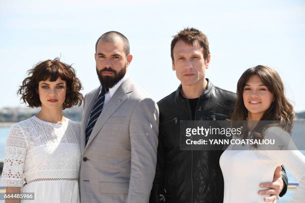 Actors Olivia Ross, Tom cullen, Simon Merells and Sabrina Bartlett, performing in "Knightfall" TV drama, pose during the MIPTV event in Cannes,...