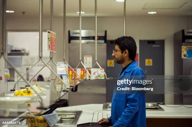 An employee waits for food in the cafeteria at the Intel Corp. Design center in Guadalajara, Mexico, on Thursday, March 9, 2017. Guadalajara's...