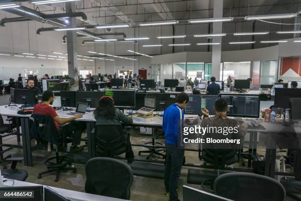 Employees work on computers at the Wizeline Inc. Office in Guadalajara, Mexico, on Friday, March 10, 2017. Guadalajara's Governor Aristoteles...
