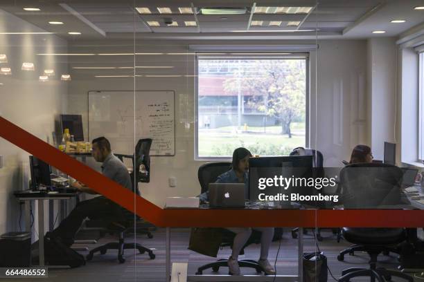 Employees work on computers at the Wizeline Inc. Office in Guadalajara, Mexico, on Friday, March 10, 2017. Guadalajara's Governor Aristoteles...