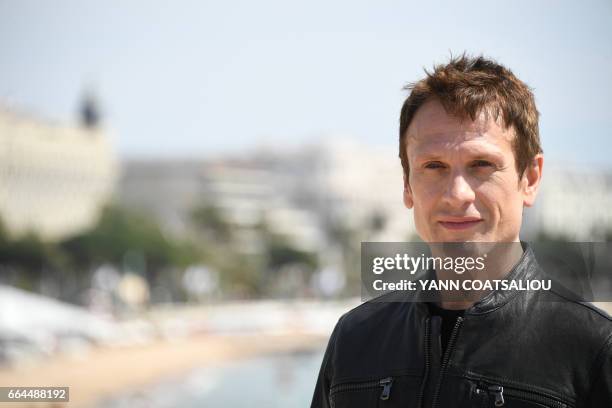 British actor Simon Merells, performing in "Knightfall" TV drama, poses during the MIPTV event in Cannes, southern France, on April 4, 2017.