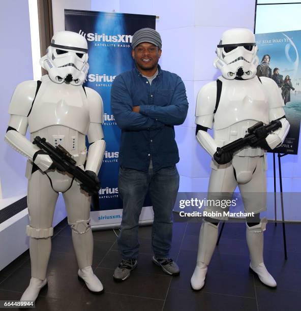 SiriusXM host Sway Calloway poses with Stormtroopers for Blu-Ray release of Rouge One at SiriusXM Studios on April 4, 2017 in New York City.