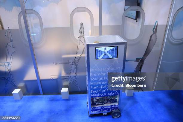 Robotic waiter catering device manufactured by Altran Technologies SA operates at the Aircraft Interiors Expo in Hamburg, Germany, on Tuesday, April...