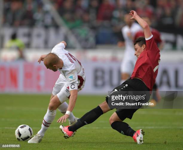 Edgar Prib of Hannover is challenged by Miso Brecko of Nuernberg during the Second Bundesliga match between Hannover 96 and 1. FC Nuernberg at...