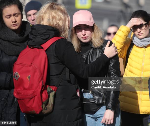 People attend a commemoration ceremony to mark the victims of the terrorist attack in St Petersburg, Russia on April 4, 2017. A blast hit a train...