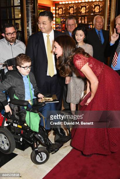 Catherine, Duchess of Cambridge, meets Ollie Duell at the Opening Night Royal Gala performance of "42nd Street" in aid of the East Anglia Children's...