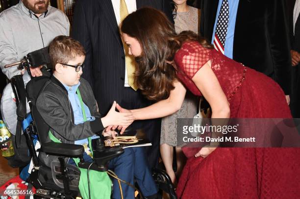 Catherine, Duchess of Cambridge, meets Ollie Duell at the Opening Night Royal Gala performance of "42nd Street" in aid of the East Anglia Children's...