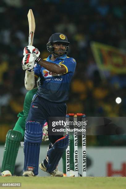 Sri Lanka's Kusal Janith Perera plays a shot during the first Twenty20 cricket match between Bangladesh and Sri Lanka in Colombo, Sri Lanka, Tuesday,...