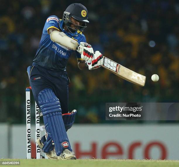 Sri Lanka's Kusal Janith Perera plays a shot during the first Twenty20 cricket match between Bangladesh and Sri Lanka in Colombo, Sri Lanka, Tuesday,...