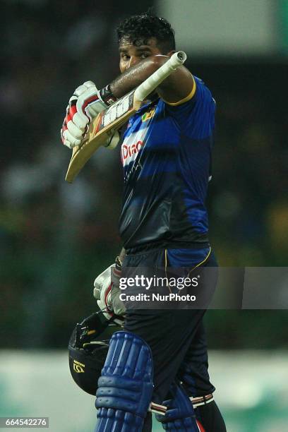 Sri Lanka's Kusal Perera looks on as he walks off after being dismissed during the first Twenty20 cricket match between Bangladesh and Sri Lanka in...