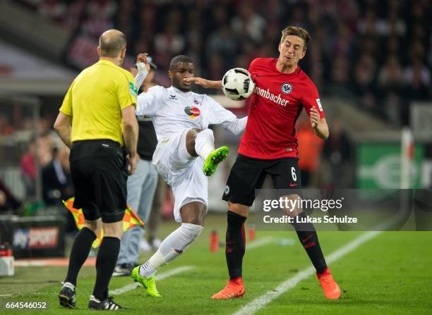 Anthony Modeste of Koeln and Bastian Oczipka of Frankfurt in action during the Bundesliga match between 1. FC Koeln and Eintracht Frankfurt at...