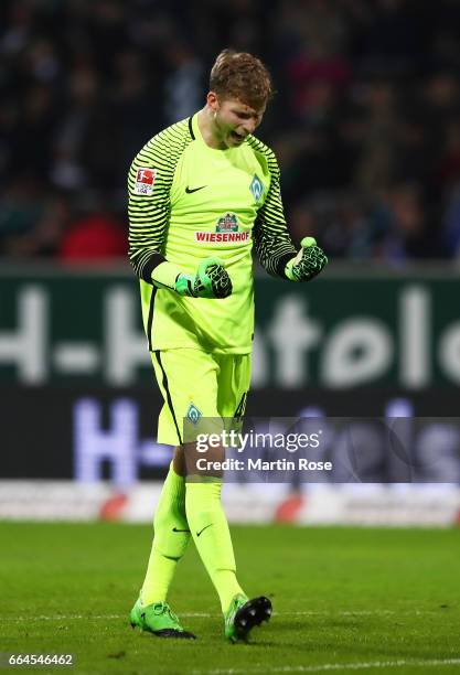 Felix Wiedwald of Werder Bremen celebrates the first goal socred by Theodor Gebre Selassie during the Bundesliga match between Werder Bremen and FC...