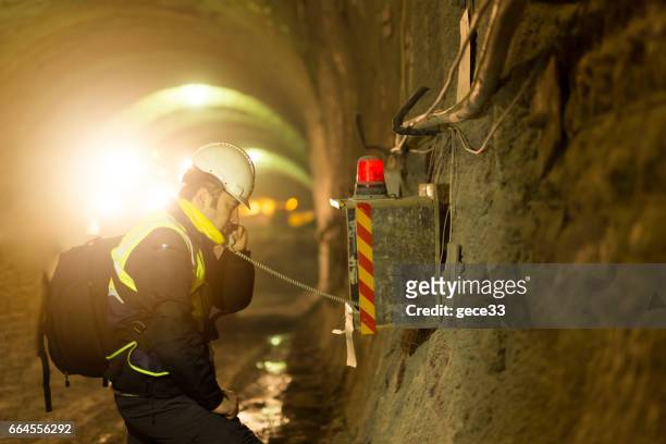 worker using emergency phone - mining worker stock pictures, royalty-free photos & images
