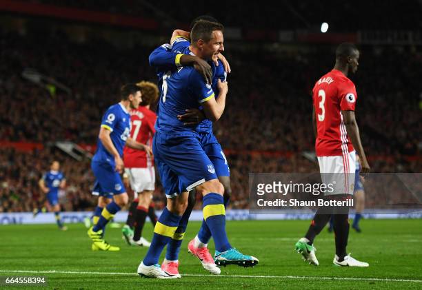 Phil Jagielka of Everton celebrates scoring his sides first goal during the Premier League match between Manchester United and Everton at Old...