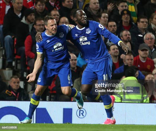 Phil Jagielka of Everton celebrates scoring their first goal during the Premier League match between Manchester United and Everton at Old Trafford on...
