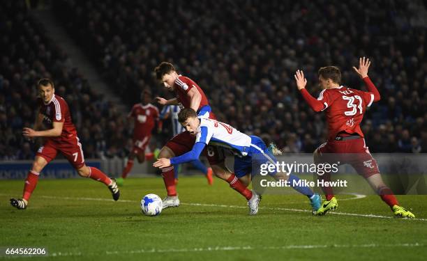 Stephen Gleeson of Birmingham City fouls Solly March of Brighton and Hove Albion during the Sky Bet Championship match between Brighton & Hove Albion...