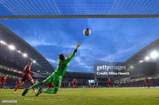 Glenn Murray of Brighton and Hove Albion beats Tomasz Kuszczak of Birmingham City to score his sides first goal during the Sky Bet Championship match...