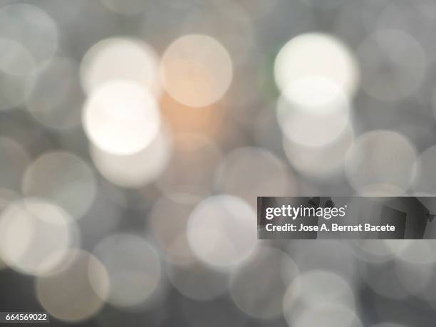 close-up of defocused light in the shape of circles - luz de navidad stock pictures, royalty-free photos & images