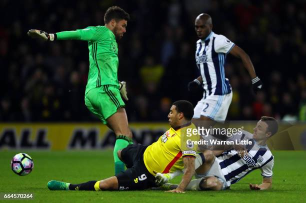 Troy Deeney of Watford scores his sides second goal past Ben Foster of West Bromwich Albion during the Premier League match between Watford and West...