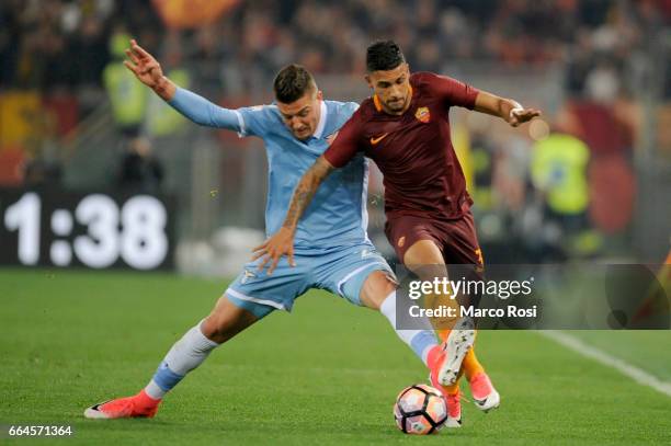 Sergej Milinkovic Savic of SS Lazio battles with Emerson palmieri of AS Roma during the TIM Cup match between AS Roma and SS Lazio at Stadio Olimpico...