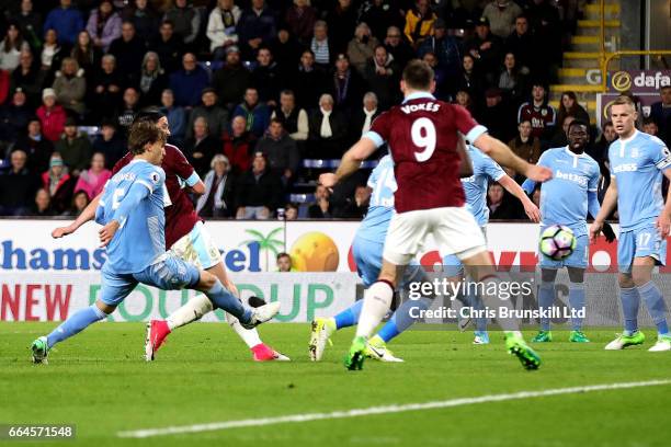 George Boyd of Burnley scores the opening goal during the Premier League match between Burnley and Stoke City at Turf Moor on April 4, 2017 in...