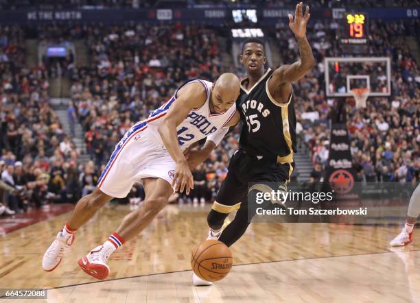 Gerald Henderson of the Philadelphia 76ers dribbles past Delon Wright of the Toronto Raptors during NBA game action at Air Canada Centre on April 2,...