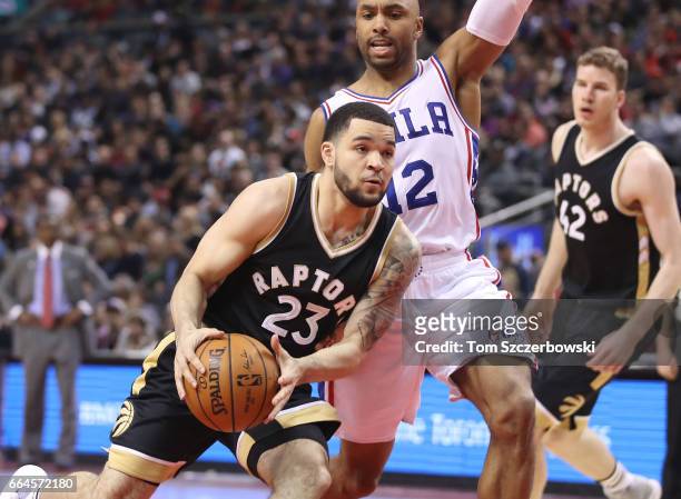 Fred VanVleet of the Toronto Raptors drives to the basket against Gerald Henderson of the Philadelphia 76ers during NBA game action at Air Canada...